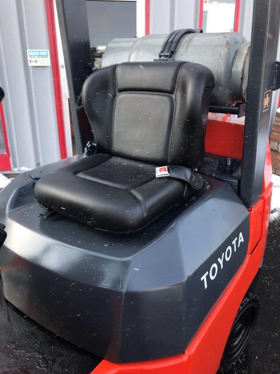 Red toyota forklift with new traction cushion tires for sale